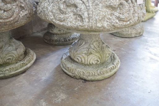 A matched set of four circular reconstituted stone garden planters, moulded with acanthus scrolls, diameter 44cm, height 47cm